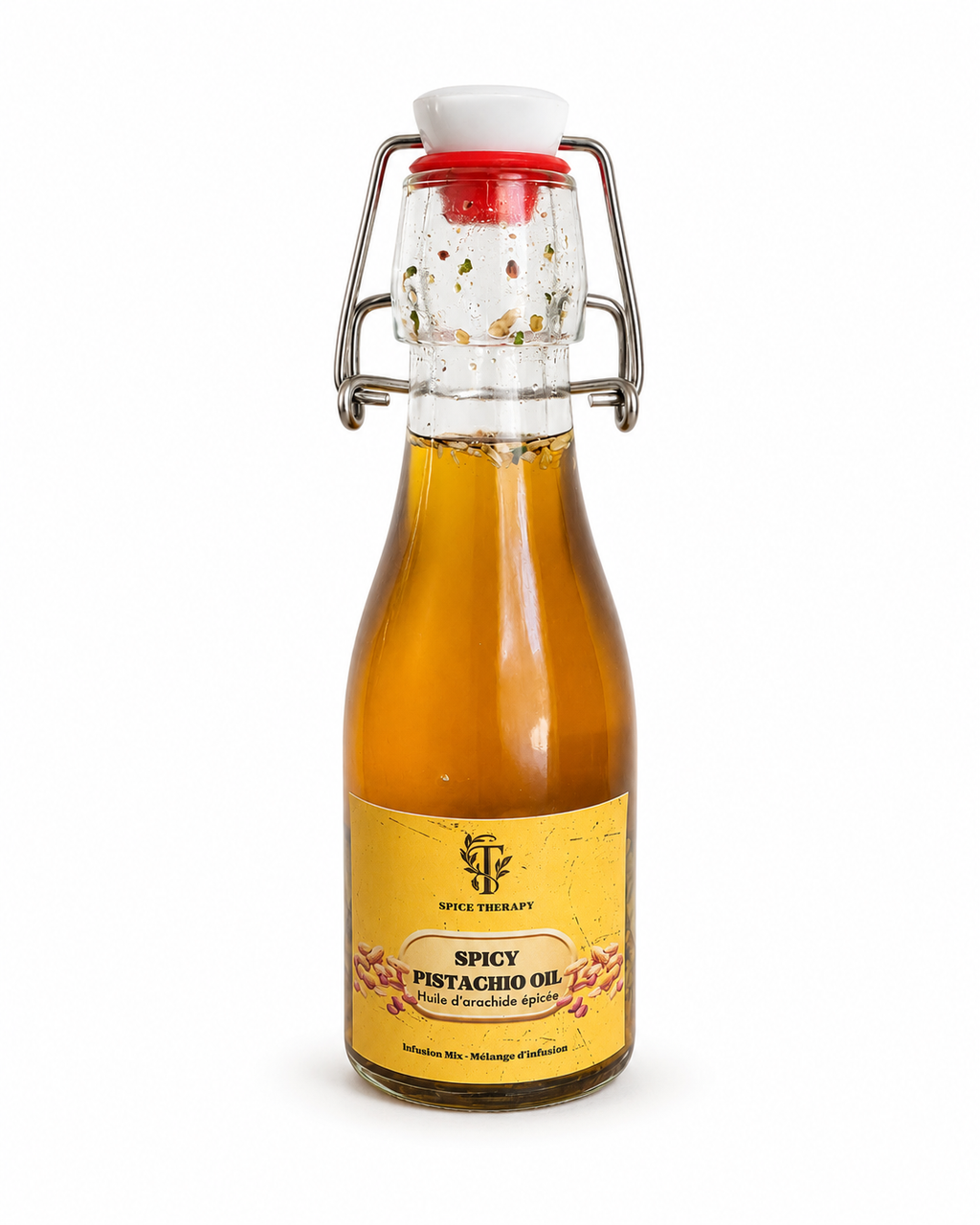 Bottle of spicy pistachio oil with a swing-top lid on a white background